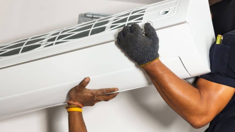 Workers are installing air conditioners